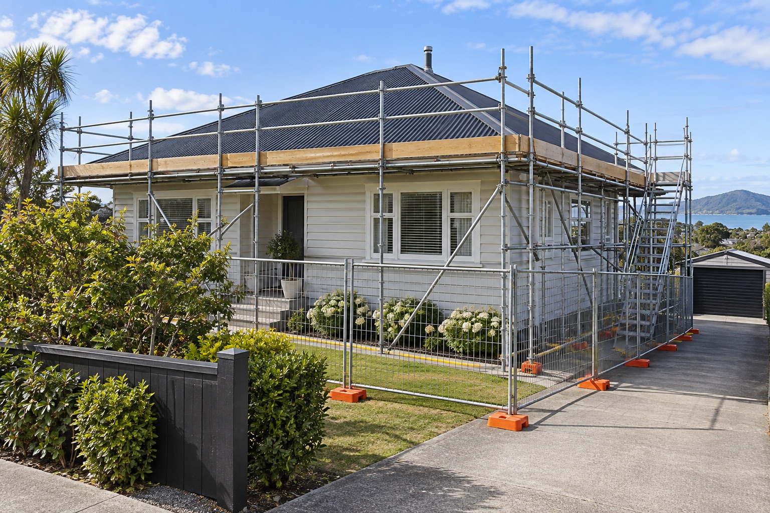 A fictional home with temporary scaffolding and separated work area